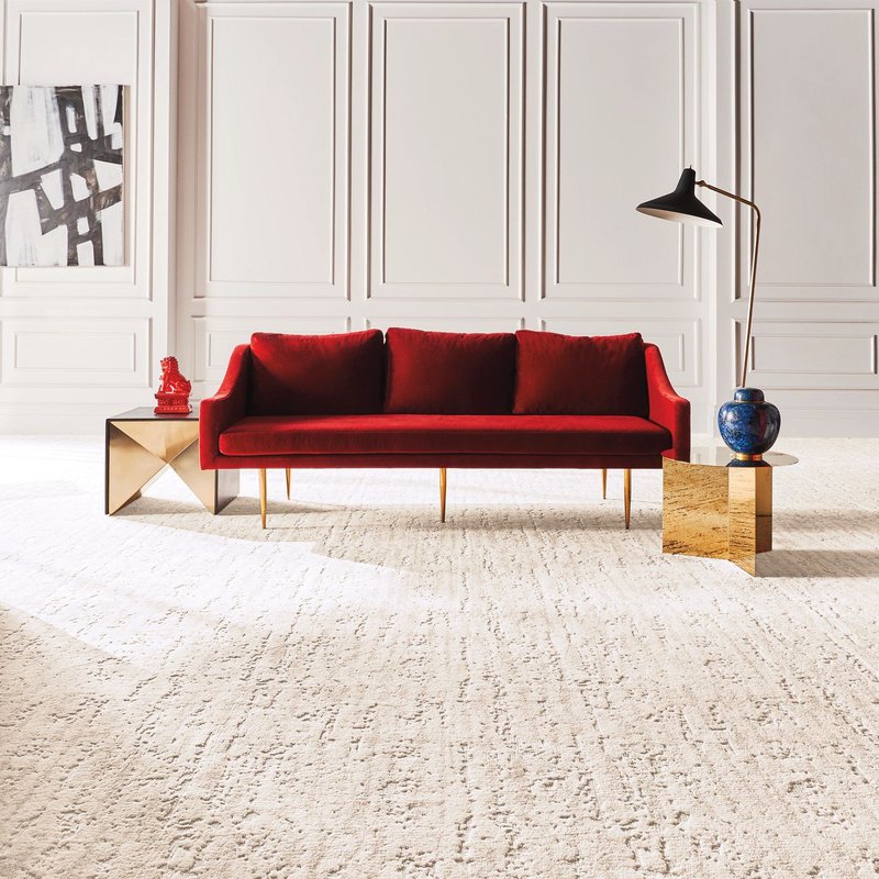 A red couch on a white carpet from EZ Floors Inc in Houston, TX